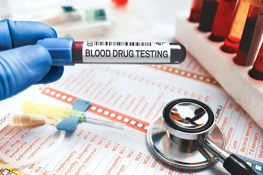 Blood drug testing device with sample tubes and a stethoscope